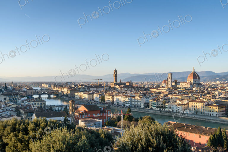 View across the rooftops of Florence, historic renaissance architectural landmarks,…