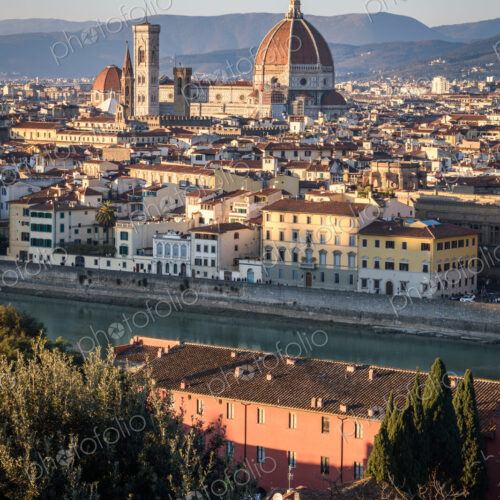View across the rooftops of Florence, historic renaissance architectural landmarks,…