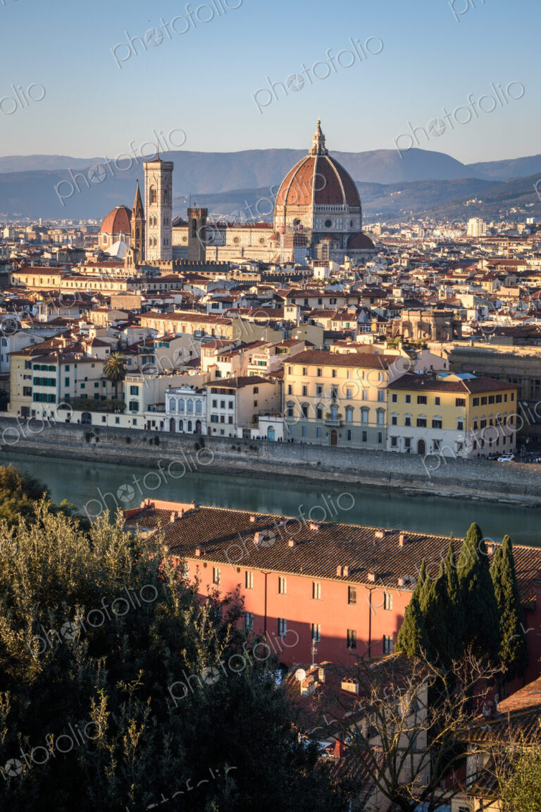 View across the rooftops of Florence, historic renaissance architectural landmarks,…