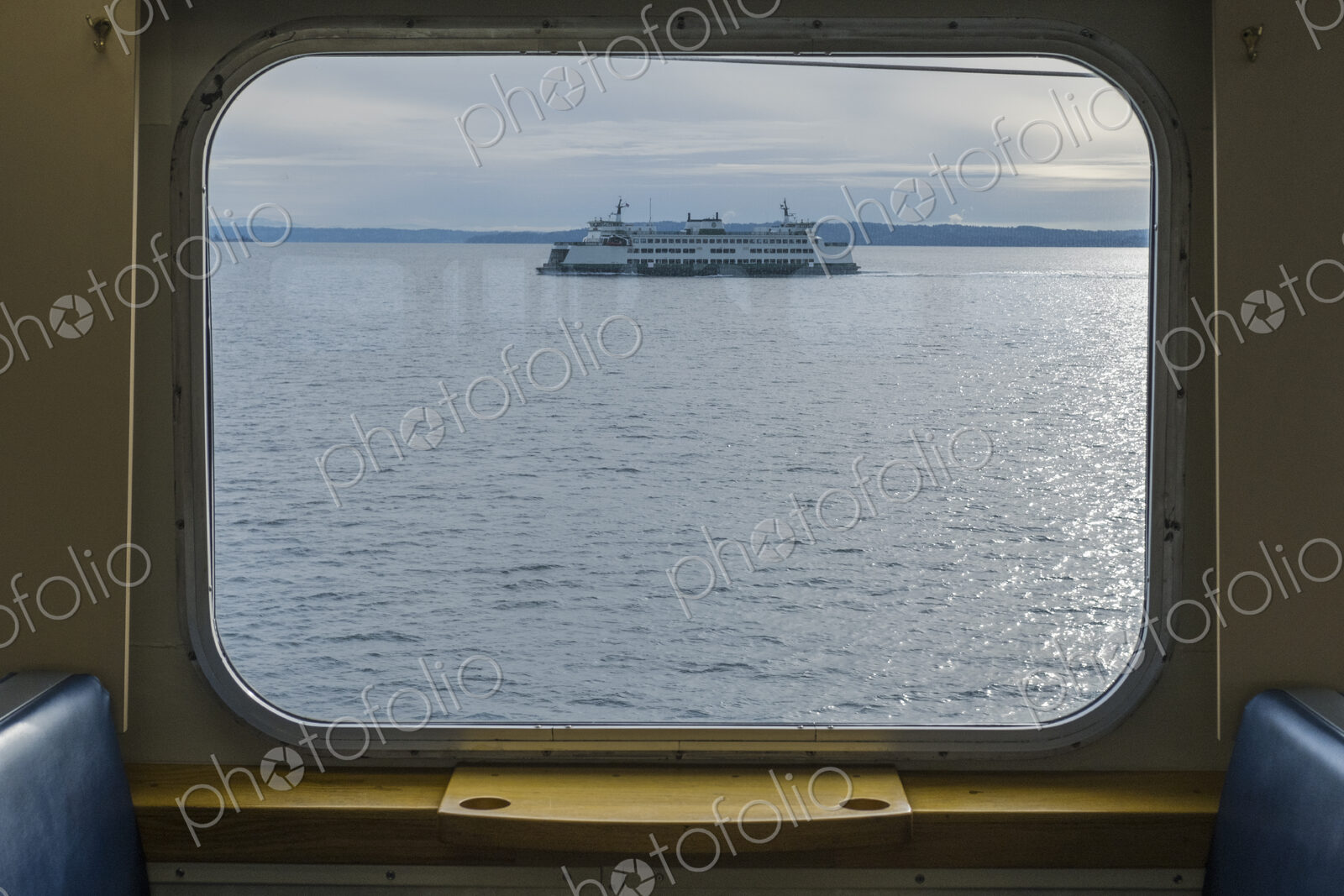 View across water from a ferry boat window, a ferry in Puget Sound,