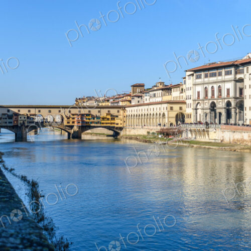 View along the Amo river towards the Ponte Vecchio, Florence, Italy. View along the Amo river towards the Ponte Vecchio, Florence, Italy.