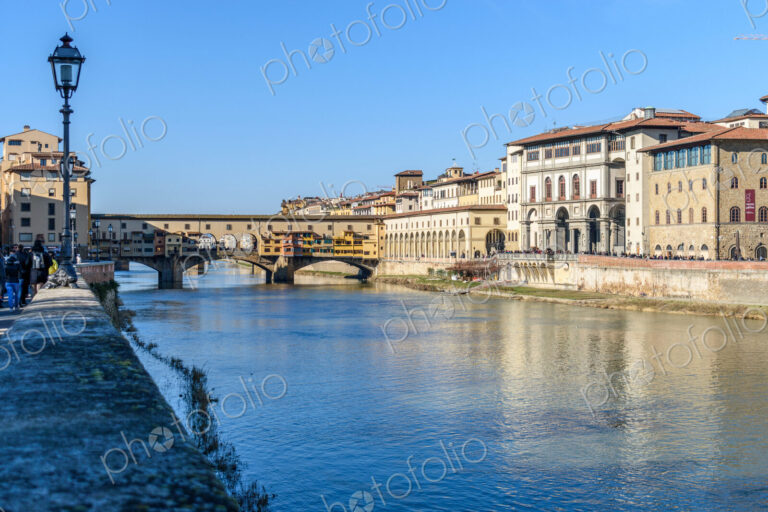 View along the Amo river towards the Ponte Vecchio, Florence, Italy.