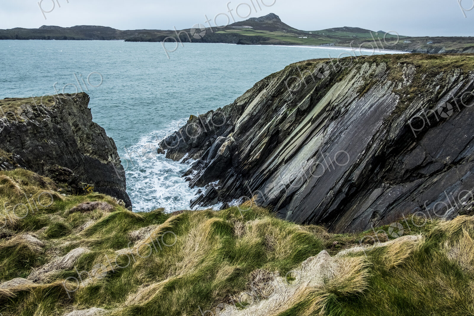 View along the coastline with rocky cliffs, Pembrokeshire National Park, Wales, UK.