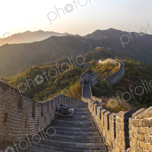 View down steps of the Great Wall, Mutianyu, Beijing, China, with mountain landscape… View down steps of the Great Wall, Mutianyu, Beijing, China, with mountain landscape…