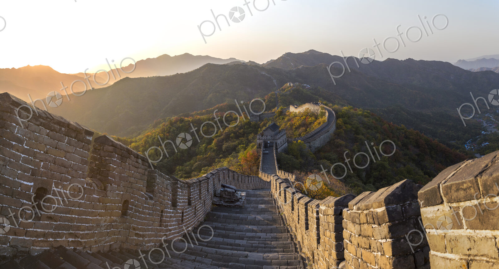 View down steps of the Great Wall, Mutianyu, Beijing, China, with mountain landscape…