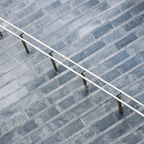View from above looking down on a series of steps up to an office buidling.
