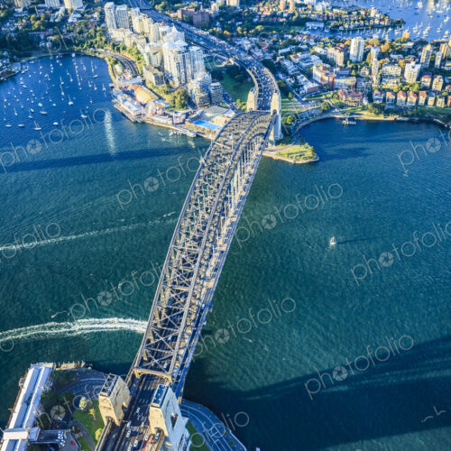 View from above of the Sydney Harbour Bridge and the city of Sydney, downtown and…
