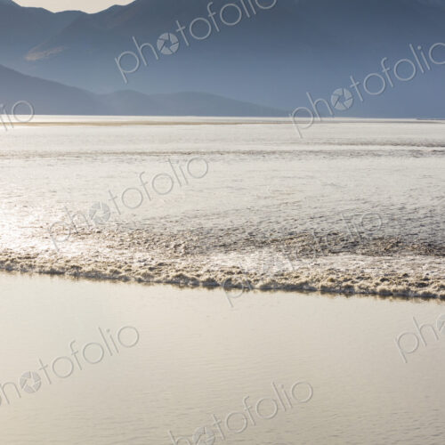 View from above of the Turnagain Arm Tidal Bore, a rolling wave of water which surges… View from above of the Turnagain Arm Tidal Bore, a rolling wave of water which surges…
