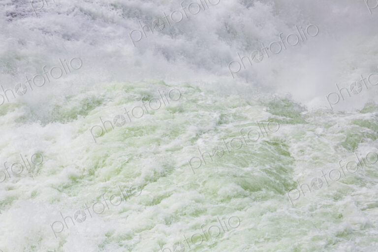 View from above of the torrents of the Spokane Falls, full frame, white water.