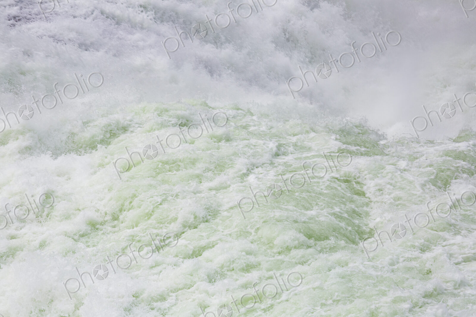View from above of the torrents of the Spokane Falls, full frame, white water.