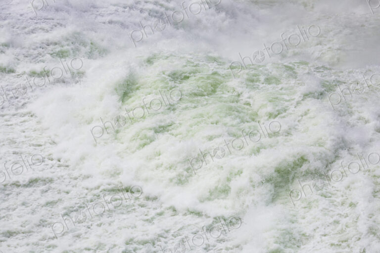 View from above of the torrents of the Spokane Falls, full frame, white water.