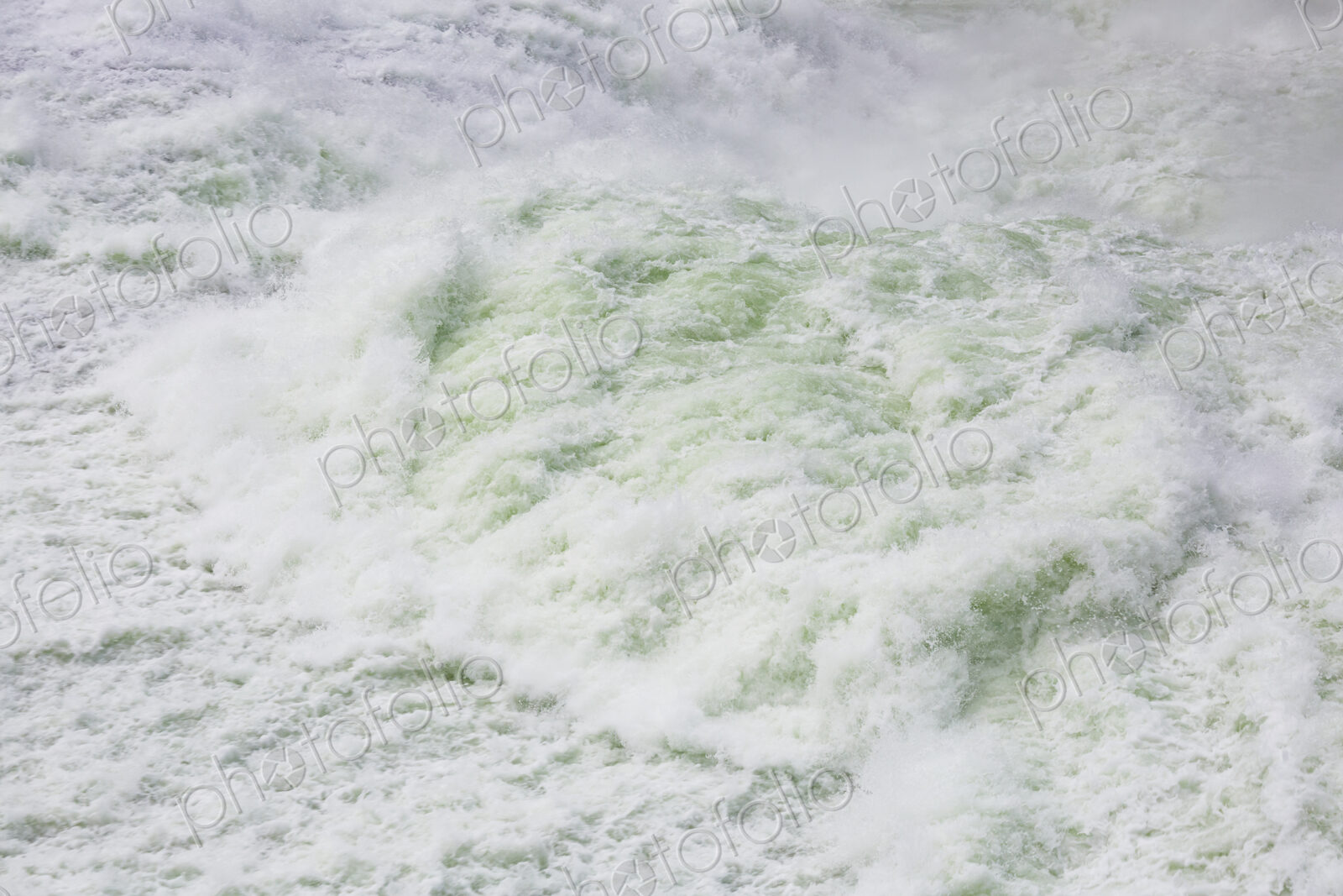 View from above of the torrents of the Spokane Falls, full frame, white water.
