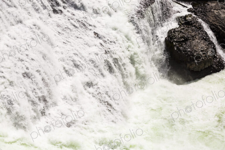 View from above of the torrents of the Spokane Falls, full frame, white water.