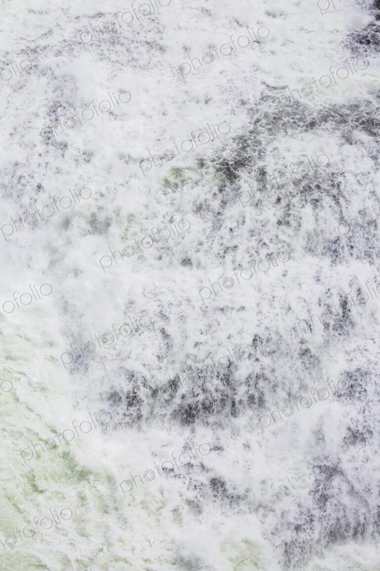 View from above of the torrents of the Spokane Falls, full frame, white water.