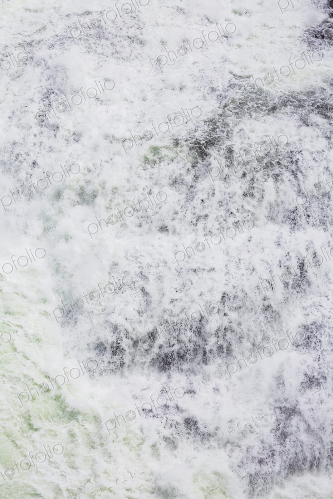 View from above of the torrents of the Spokane Falls, full frame, white water.
