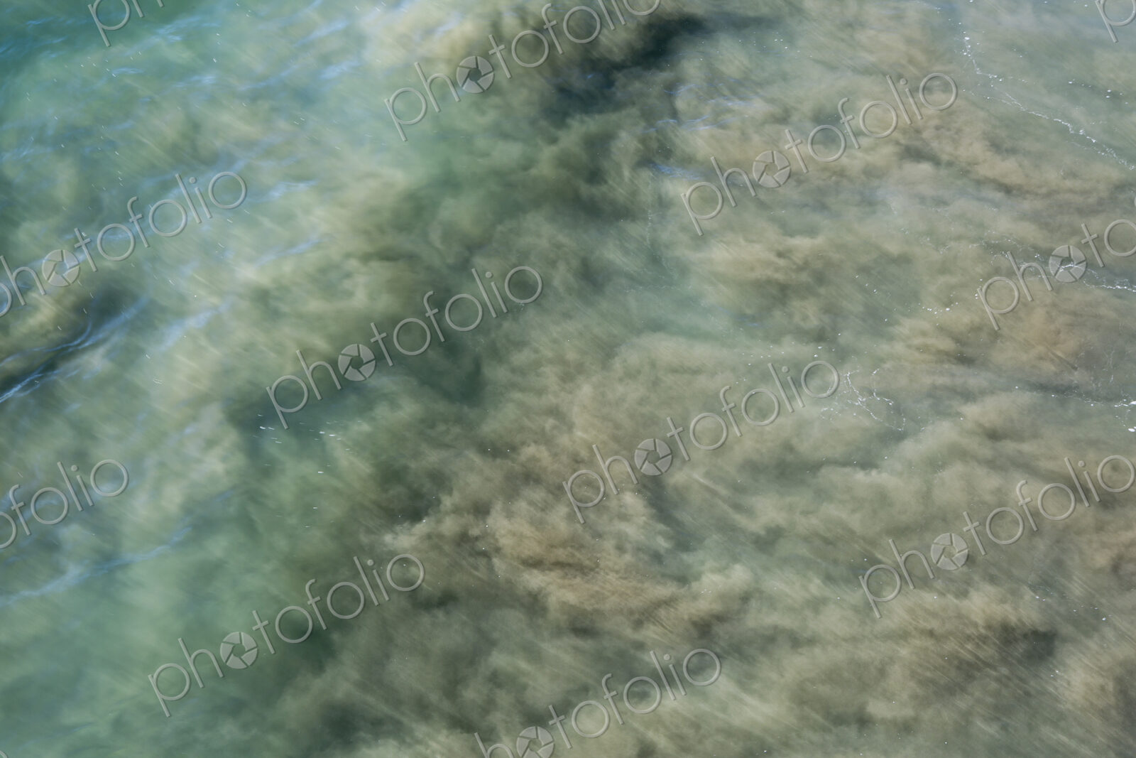 View from above on the waters, waves and incoming surf, near Big Sur on the California…