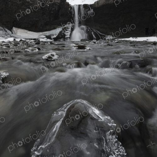 View from downriver of the Skokafoss waterfall, cascading down a cliff, low angle view…