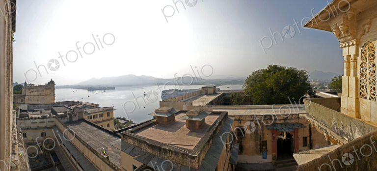 View from the City Palace historic buildings, balconies overlooking the lake Pichola,…