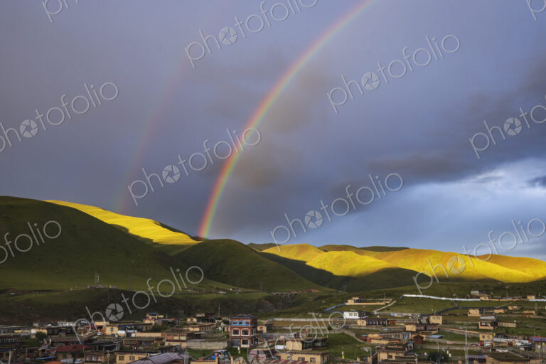 View from the Dege Zhuqing Mansion Hotel at Sunset, a double rainbow.