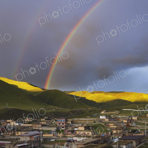 View from the Dege Zhuqing Mansion Hotel at Sunset, a double rainbow in the sky above… View from the Dege Zhuqing Mansion Hotel at Sunset, a double rainbow in the sky above…