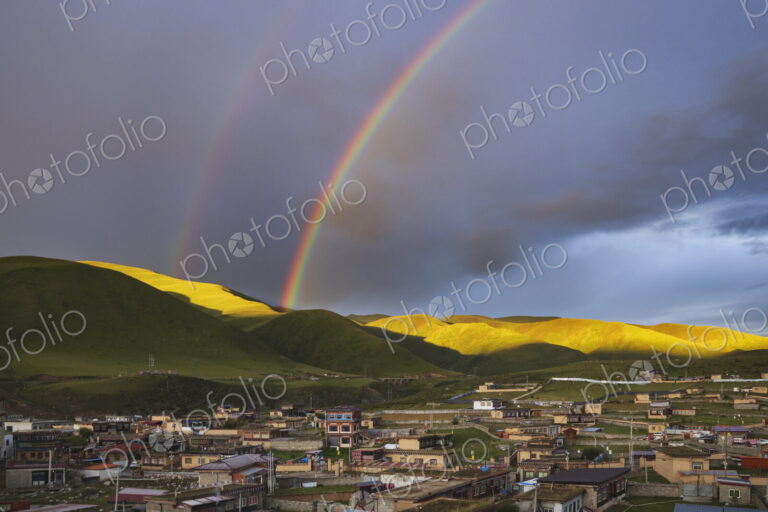 View from the Dege Zhuqing Mansion Hotel at Sunset, a double rainbow in the sky above…
