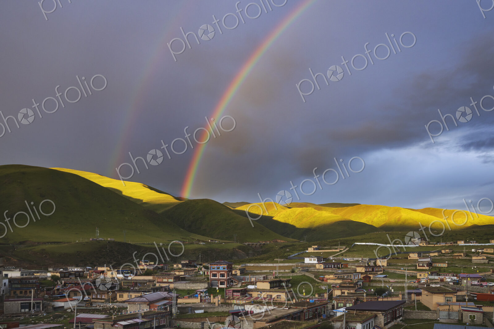 View from the Dege Zhuqing Mansion Hotel at Sunset, a double rainbow in the sky above…