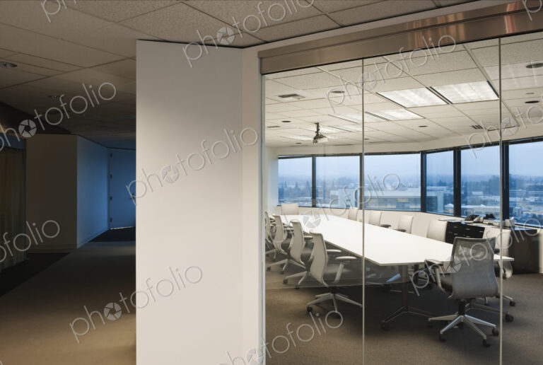 View from the outside of a conference room ready for business late in the day.
