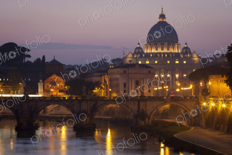 View from the river Tiber towards St. Peter's Basilica in Vatican City, Rome at dusk.