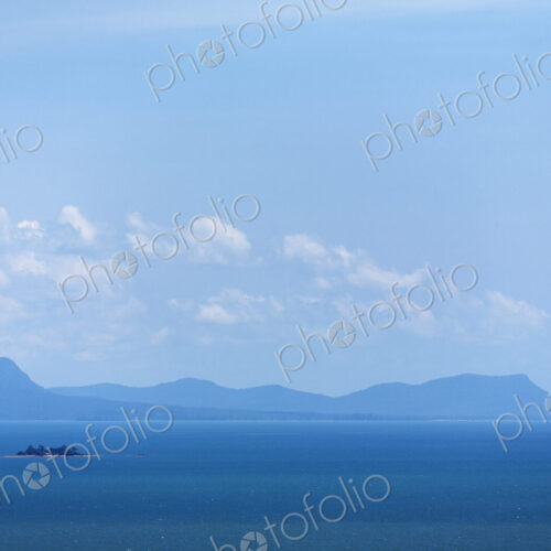 View from the sea of the Cambodian coastline with mountains in the distance. View from the sea of the Cambodian coastline with mountains in the distance.