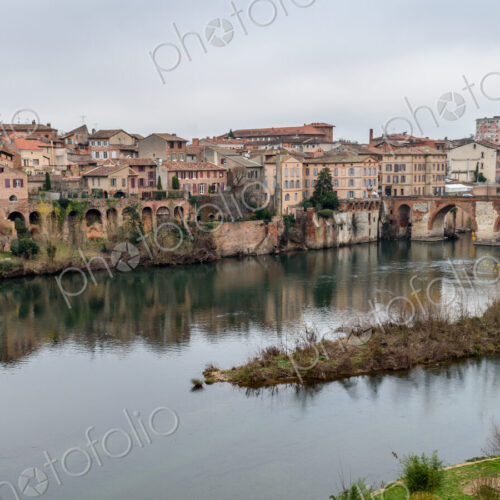 View of Albi, the city and historic buildings from the River Tarn, the Pont Vieux and… View of Albi, the city and historic buildings from the River Tarn, the Pont Vieux and…