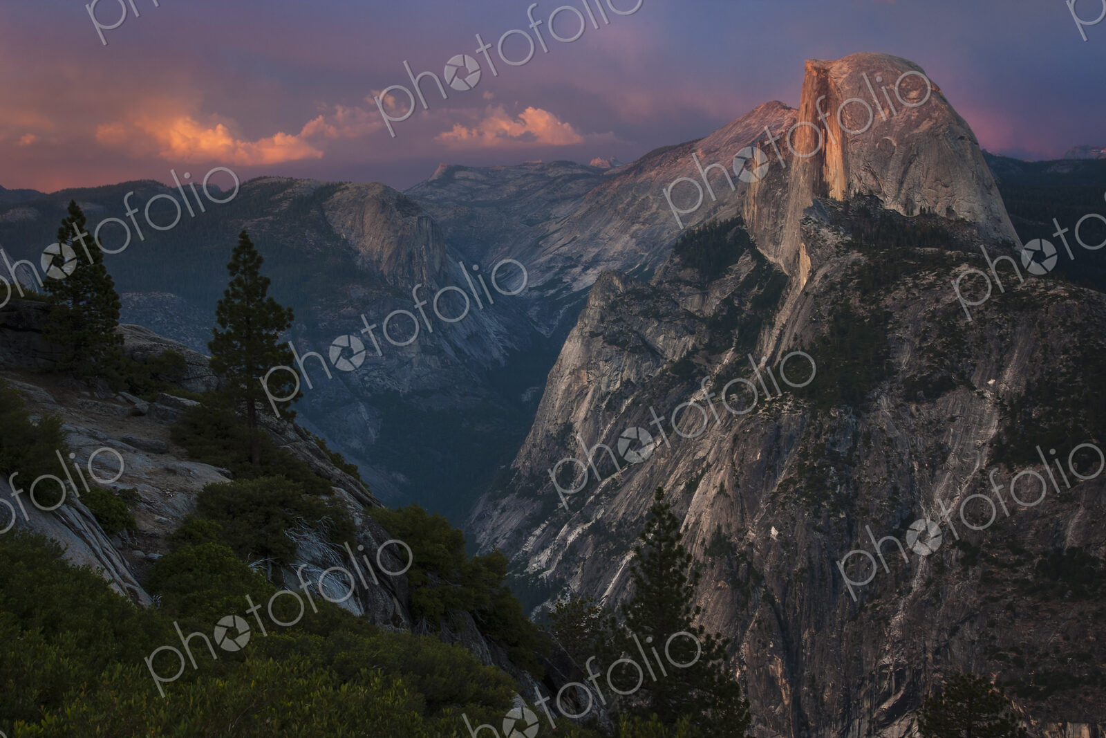 View of Half Dome in Yosemite Valley in Yosemite National Park, California at dusk.
