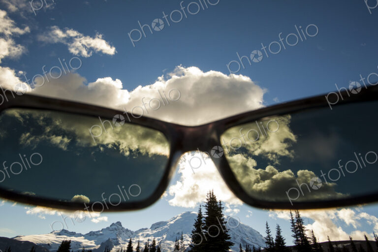 View of Mount Rainier peak though a pair of sunglasses in Mount Rainier National Park