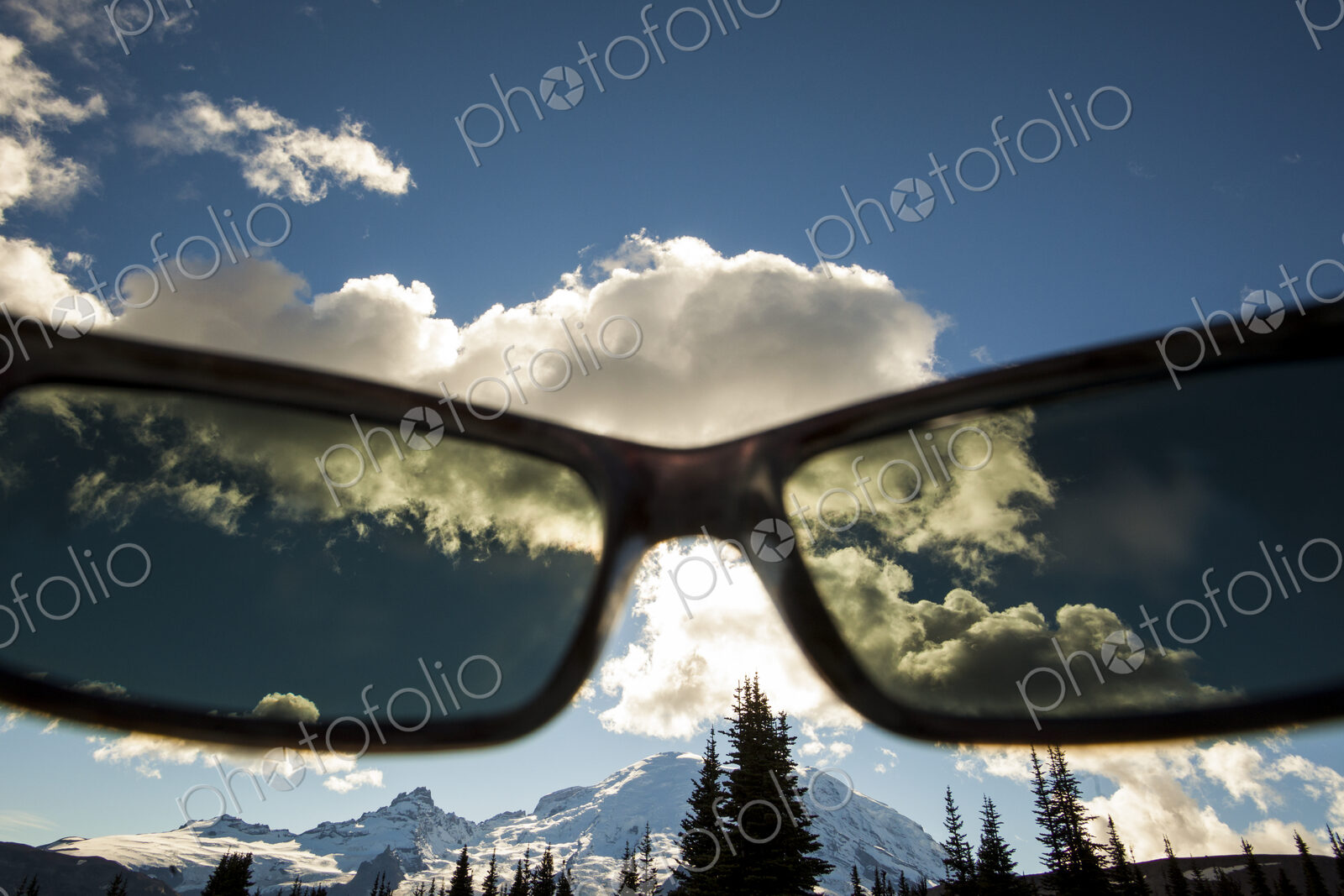 View of Mount Rainier peak though a pair of sunglasses in Mount Rainier National Park