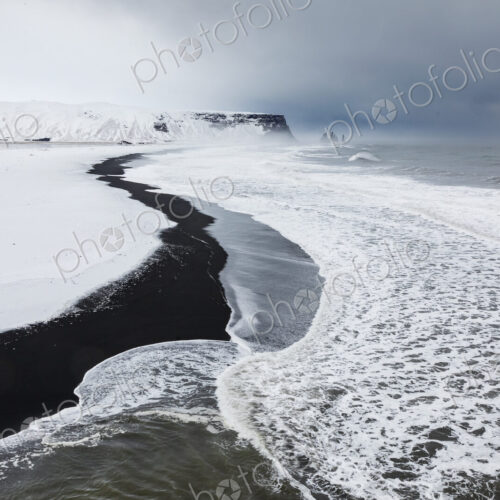 View of Reynisfjara Beach Looking towards Vik, a black sand beach, snow on the sand… View of Reynisfjara Beach Looking towards Vik, a black sand beach, snow on the sand…
