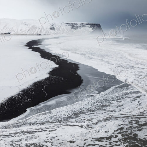 View of Reynisfjara Beach Looking towards Vik, a black sand beach, snow on the sand… View of Reynisfjara Beach Looking towards Vik, a black sand beach, snow on the sand…