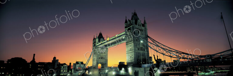 View of Tower Bridge in London, England at dusk.