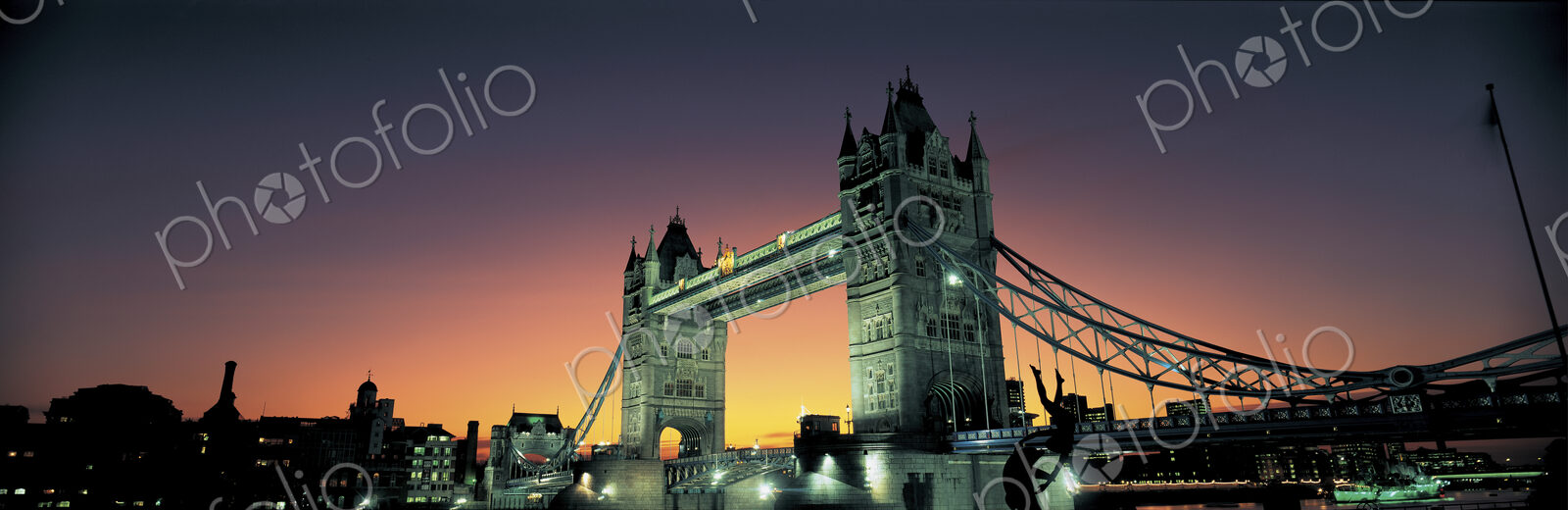 View of Tower Bridge in London, England at dusk.