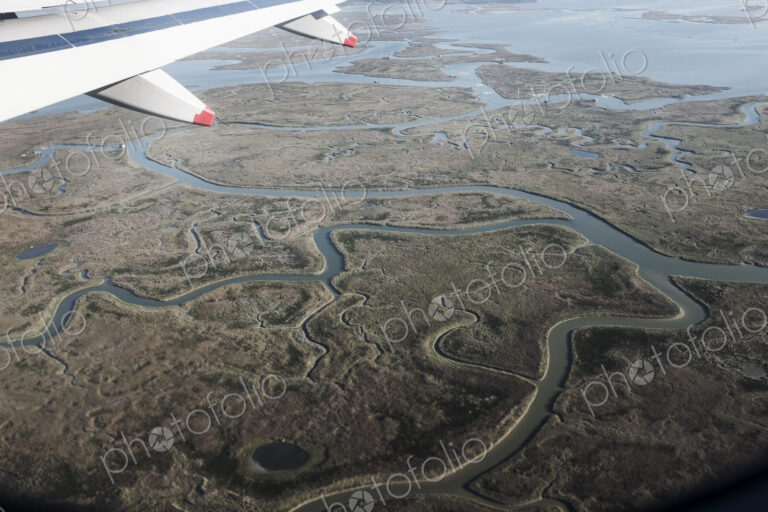 View of Venice, Veneto, Italy from a passenger plane window.