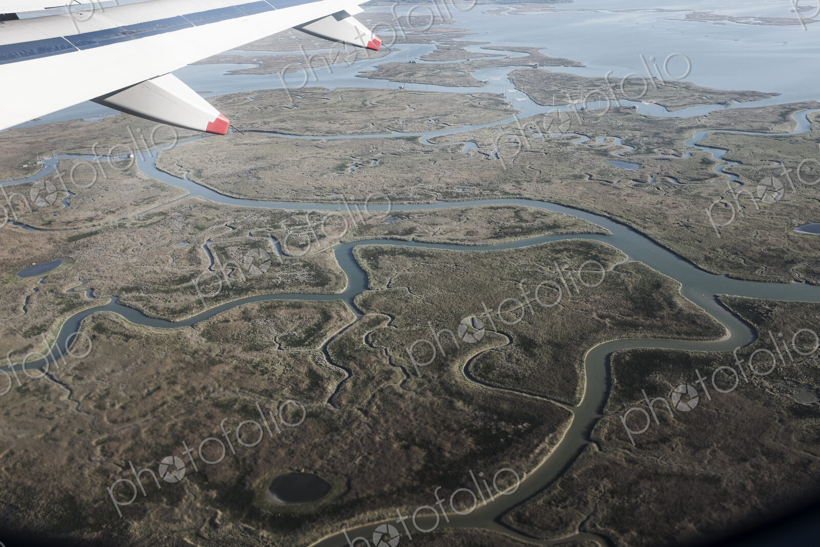 View of Venice, Veneto, Italy from a passenger plane window.