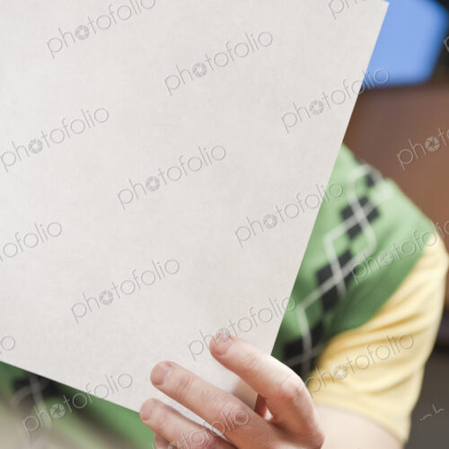 View of a Caucasian man going over paperwork in his office. View of a Caucasian man going over paperwork in his office.