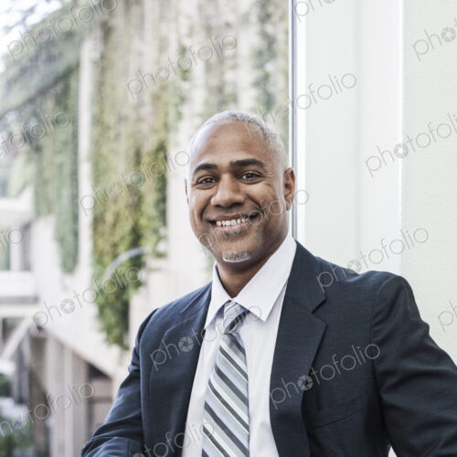 View of a black business man in a shirt and tie. View of a black business man in a shirt and tie.