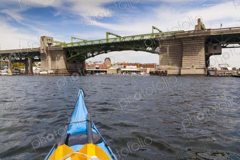 View of a person kayaking near the Ballard Bridge, Seattle,