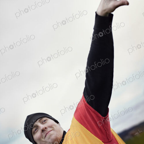 View of a quarterback leaning back and preparing to throw a football. View of a quarterback leaning back and preparing to throw a football.