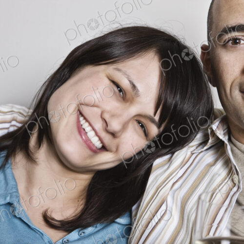 View of hispanic woman and man in their home. View of hispanic woman and man in their home.