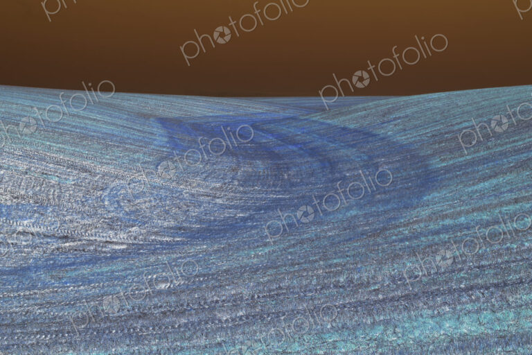 View of rolling hills and farmland, inverted image