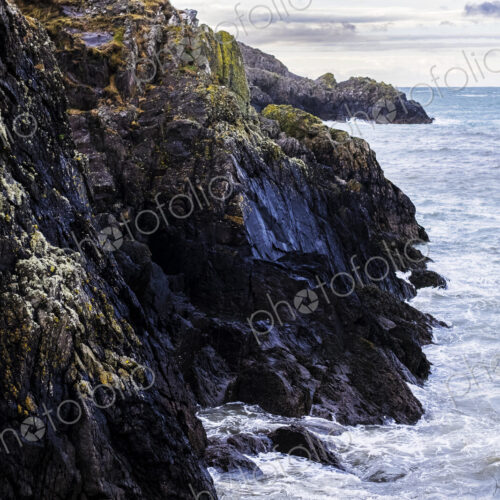 View of rugged cliffs along the coastline of Pembrokeshire National Park, Wales, UK. View of rugged cliffs along the coastline of Pembrokeshire National Park, Wales, UK.
