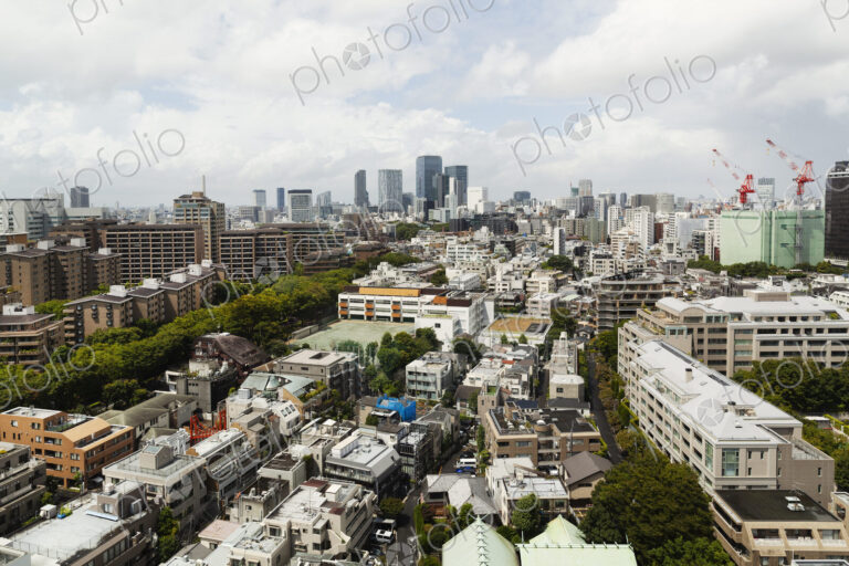 View of the Fukuoka cityscape from a rooftop terrace.