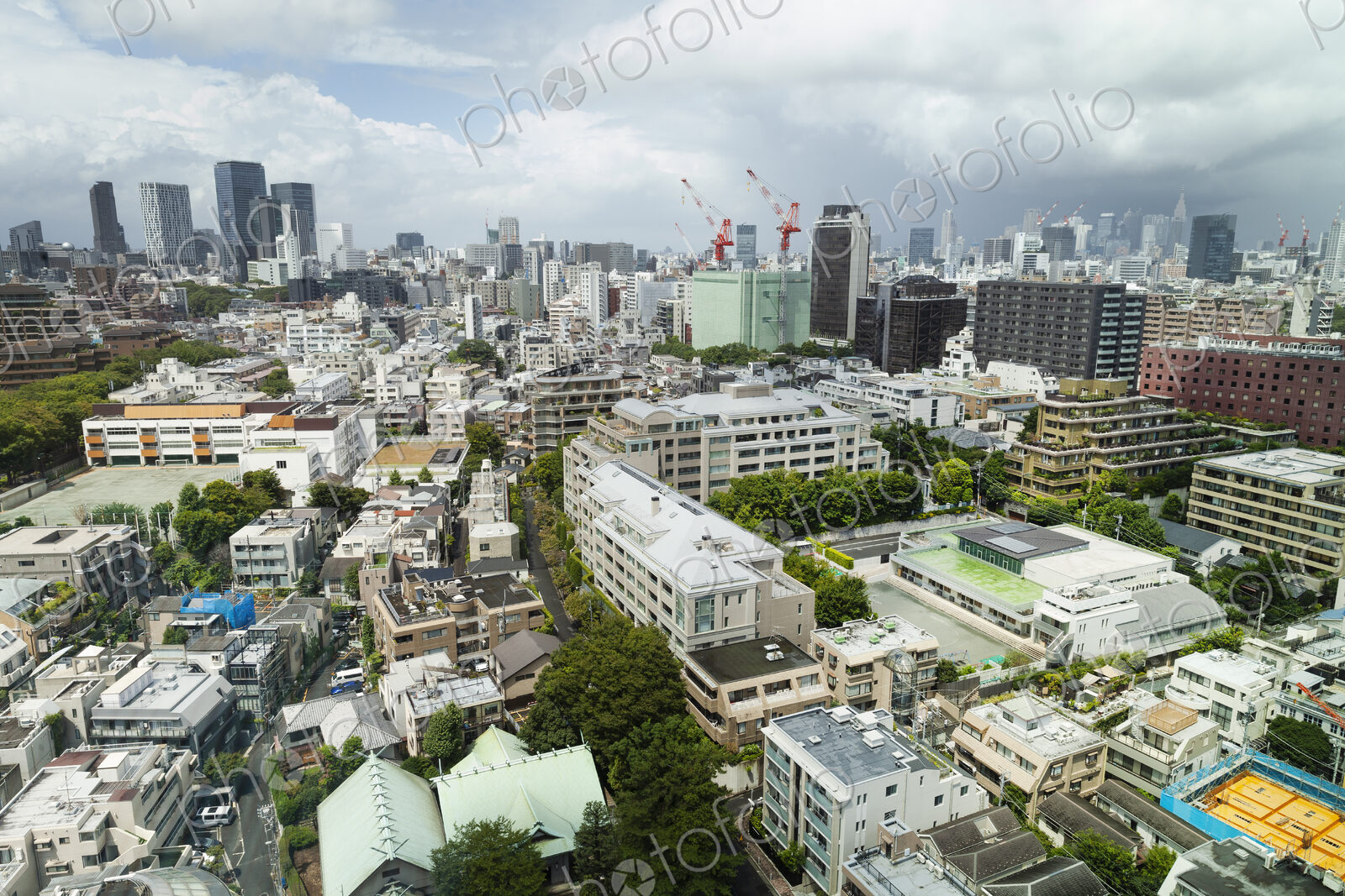 View of the Fukuoka cityscape from a rooftop terrace.