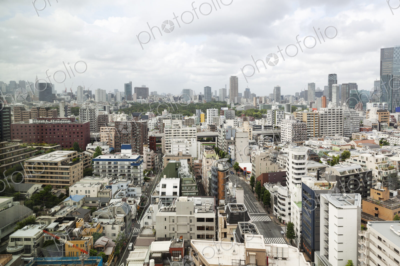 View of the Fukuoka cityscape from a rooftop terrace.