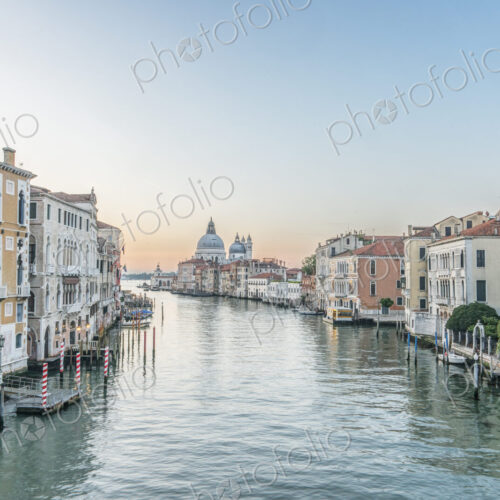 View of the Grand Canal in Venice with St Mark's Basilica dome in the distance. View of the Grand Canal in Venice with St Mark's Basilica dome in the distance.